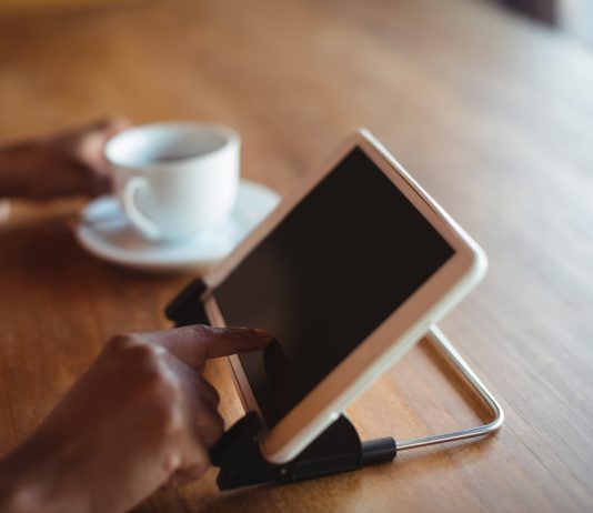 The Best Tablet Stands : Underrated Accessory With Great Functionality woman using digital tablet